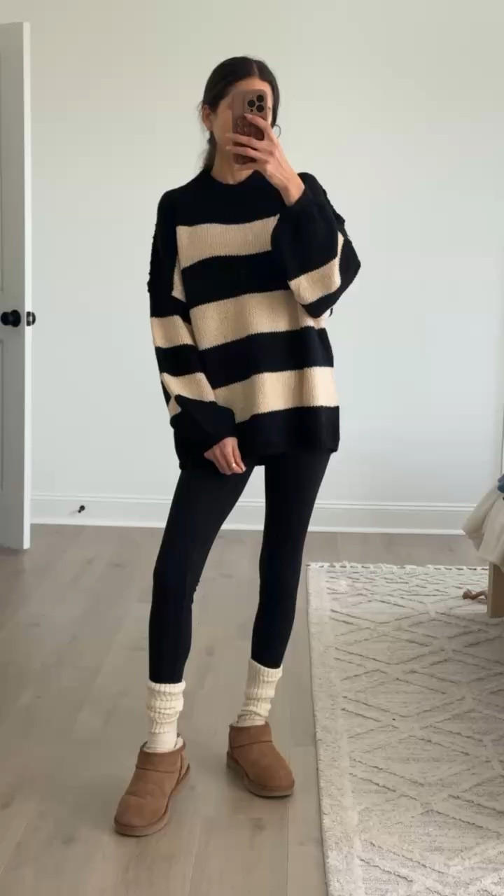 Neutral outfit ideas for everyday wear. Oversized striped sweater, black leggings, cozy socks, and classic slip-on boots. Easy casual outfit, comfy fall outfit, winter layering basics, neutral color palette, everyday mom outfit, casual athleisure look, simple capsule wardrobe pieces.

#LTKFindsUnder50 #LTKSeasonal #LTKTravel