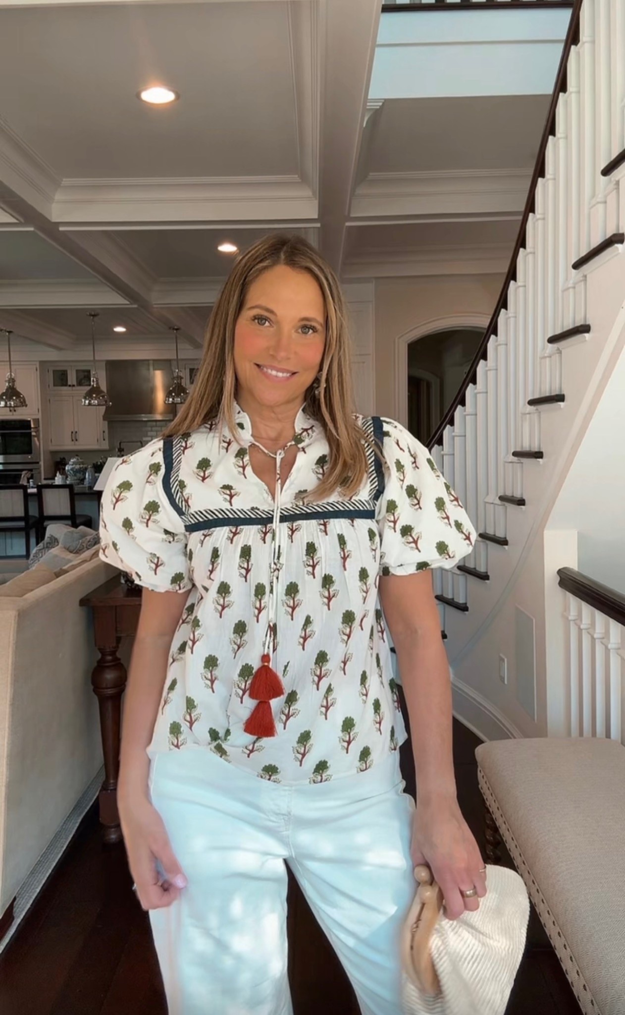 Looking for a pretty top that is a statement piece? I Just love this patterned top with puff sleeves. The tassles are a fun element to an already beautiful top! s

#LTKOver40 #LTKMidsize