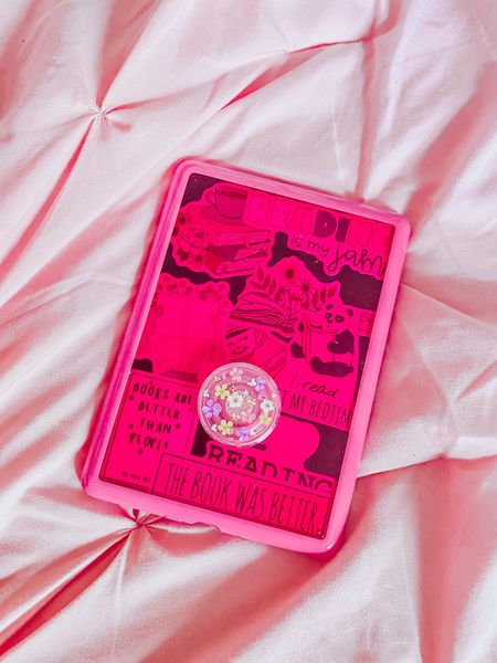 My Kindle, My Baby! 💗🥰 This has been the best purchase for me! 💌 I love it so much! 😊 I decorated it just how I wanted too. 💖 I’m a sucker for hot pink and need all my devices to match and be cohesive. 💕 So when I found this case for my Kindle Paperwhite after searching high and low for the perfect color case I found an exact one! It’s called raspberry red but it’s more of a hot pink! 💞 I love this shade so much! 💓 Then I added this pink floral popsocket which makes holding my Kindle so much easier. 🌸 I love how girly and feminine it is and matches my aesthetic perfectly. 🌷Last are these stickers I’ve had for a while that are book themed! 📚 I added them to the semi see through case to look at and love that idea that I could switch up the stickers with others when I get bored. ✨ So that’s a mini tour of my decorated kindle! I’ll share a video of me decorating it soon. ⭐️ Does your Kindle match your aesthetic?