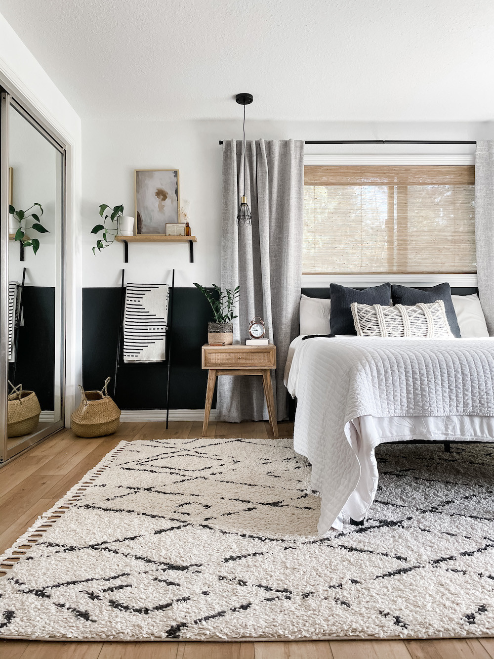 Layer, layers, and more layers. That's the design trick I used in this small bedroom makeover- once a dark, dated, and truly unsettling space. 

Layered:
- bedding
- window treatments
- half accent wall
- lighting
- artwork

Read more Small Bedroom Decor Ideas: https://www.allisajacobs.com/small-bedroom-decor-ideas/ 

 #LTKHome