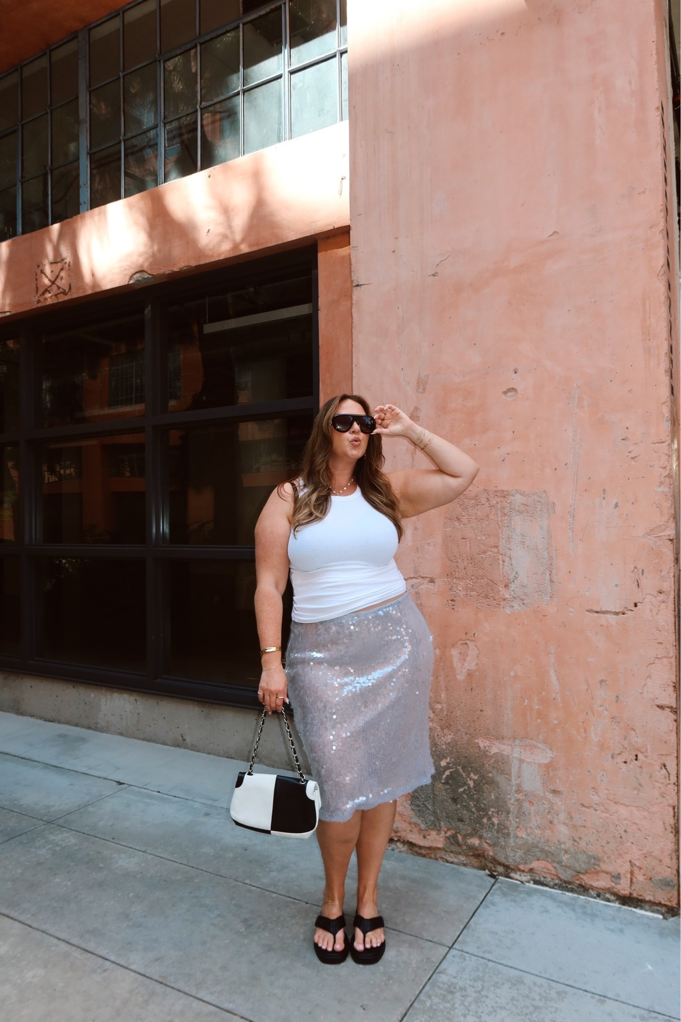 I sized up to the 18 in the skirt so I could wear it lower! The skirt is sheer so I wore my cooling thigh society shorts underneath!

My tank is super old but any ribbed high neck white tank would work!

#LTKootd #LTKMidsize