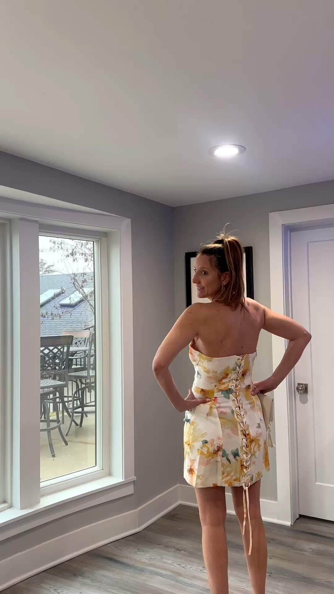 The back detail on this dress is everything. 🌸✨ A corset-lace-up finish adds such a unique, structured touch to a soft yellow floral print. It’s exactly what I want to be wearing for a garden party or a sunny brunch. Tap the link in my bio to shop this floral mini and my favorite neutral accessories! #SpringStyle #CorsetDress #FloralMini #ShopTheLook @VICI 

My Springtime Corset Style Breakdown
• The Dress: I’m wearing a strapless, mini-length dress featuring a vibrant yellow and orange floral print on a cream base.
• The Detail: The standout feature is the functional corset-style lace-up back with long, dangling ties that add a bit of drama.
• The Accessories: I’ve paired the dress with a simple cream-colored clutch to keep the focus on the bold print of the outfit.
• The Silhouette: The structured bodice and short hemline create a polished, feminine shape that’s perfect for dressier daytime events.
• The Vibe: This look is all about "romantic structure"—the floral pattern feels classic, while the lace-up detail keeps it modern and eye-catching.

Floral corset dress, lace up back mini dress, strapless yellow floral, garden party outfit, cream floral dress, spring event style, structured mini dress, feminine spring fashion, vacation date night look, LTKstyle

#LTKootd #LTKOver40 #LTKgrwm