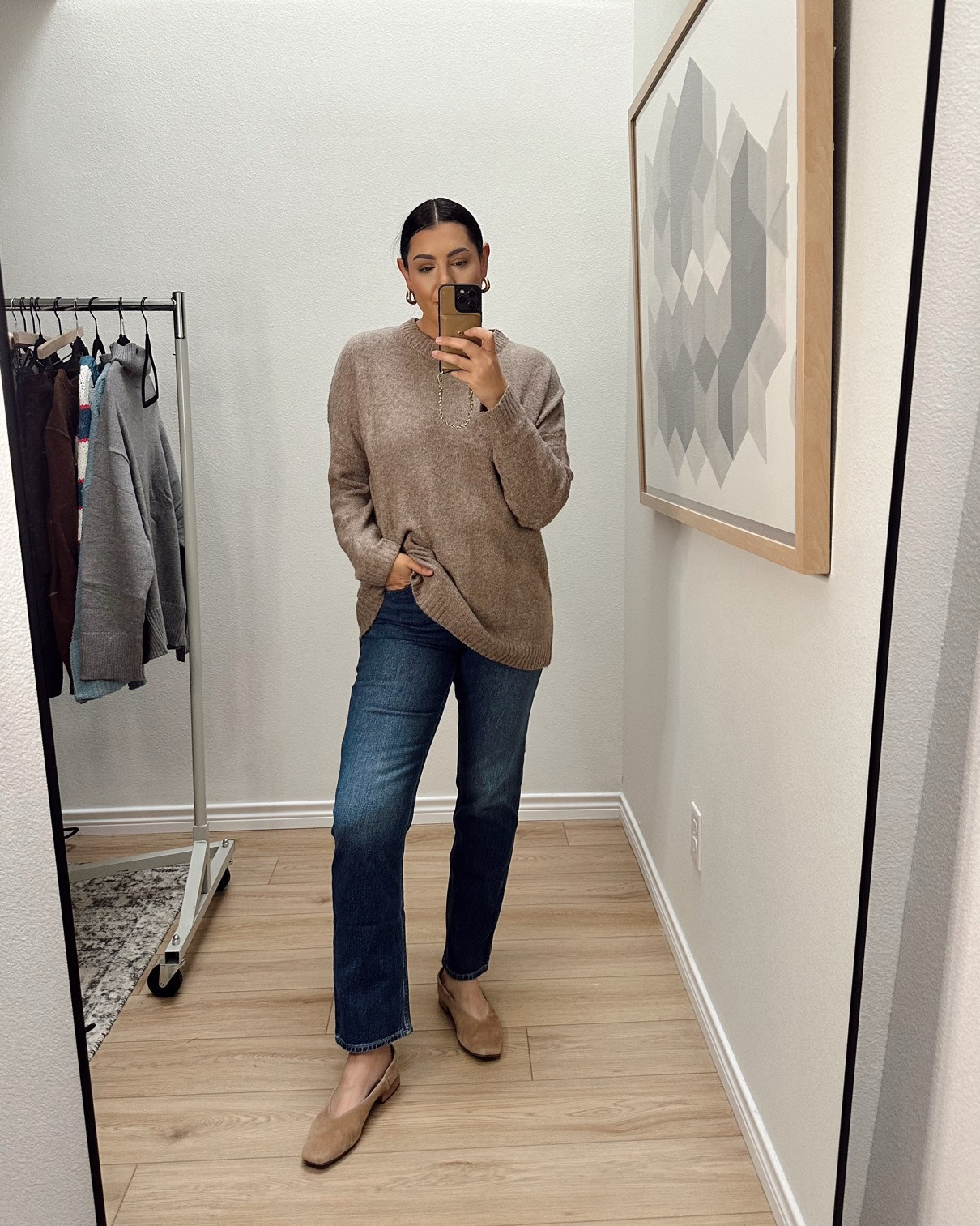 I'm in the medium of the sweater -- runs TTS with a loose fit!

I'm int he 30 of the jeans, TTS.  

 