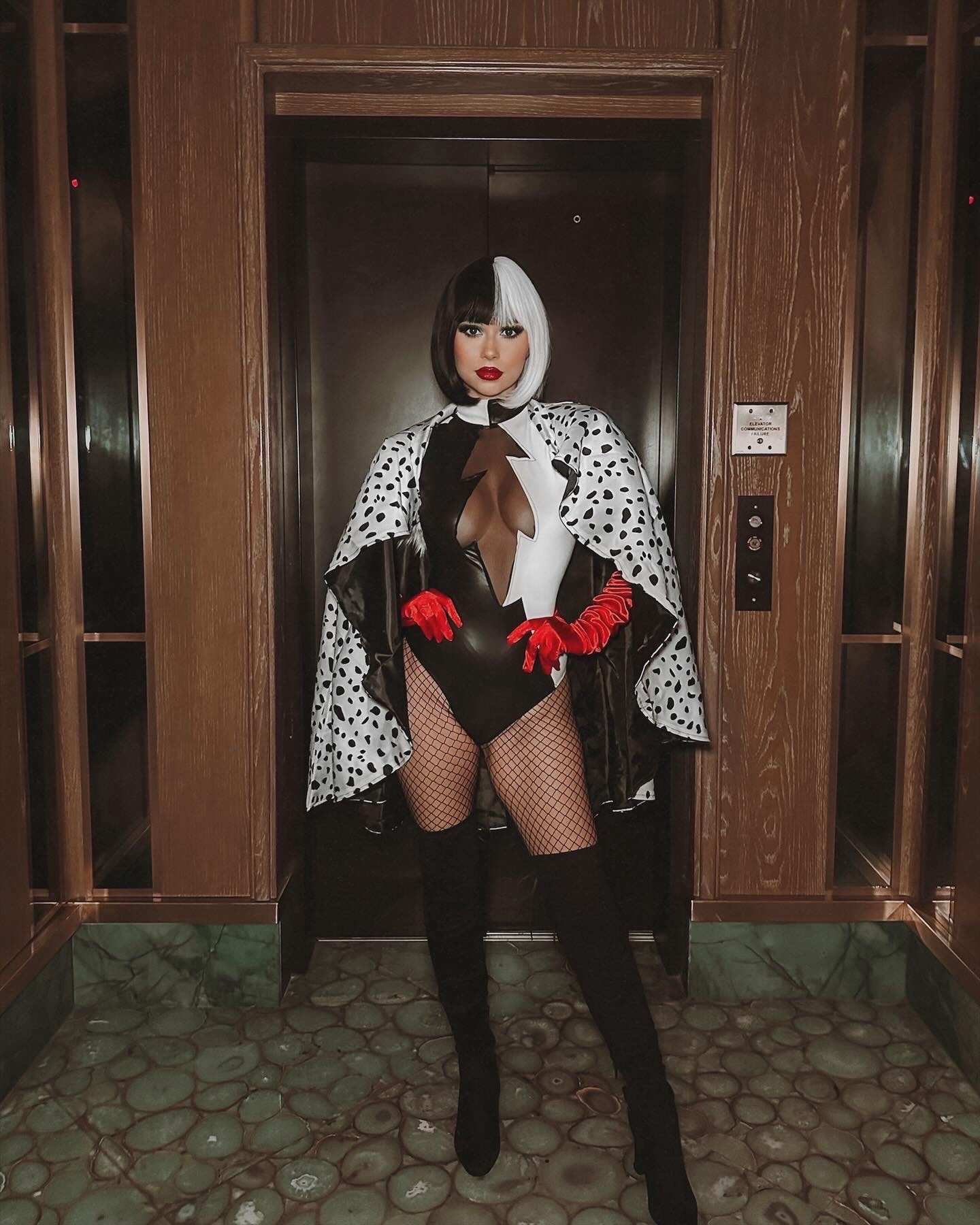 Halloween Costume Cruella De Vil 🤍🖤 Dalmatian Printed Cape / Black and White Leotard / Black tight knee high boots / red gloves / black and white wig / fenty beauty red matte liquid lipstick 

#LTKParties #LTKStyleTip #LTKHalloween