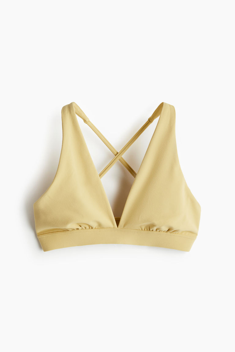 H & M - Light Support Sports bra in SoftMove - Yellow | H&M (UK, MY, IN, SG, PH, TW, HK)