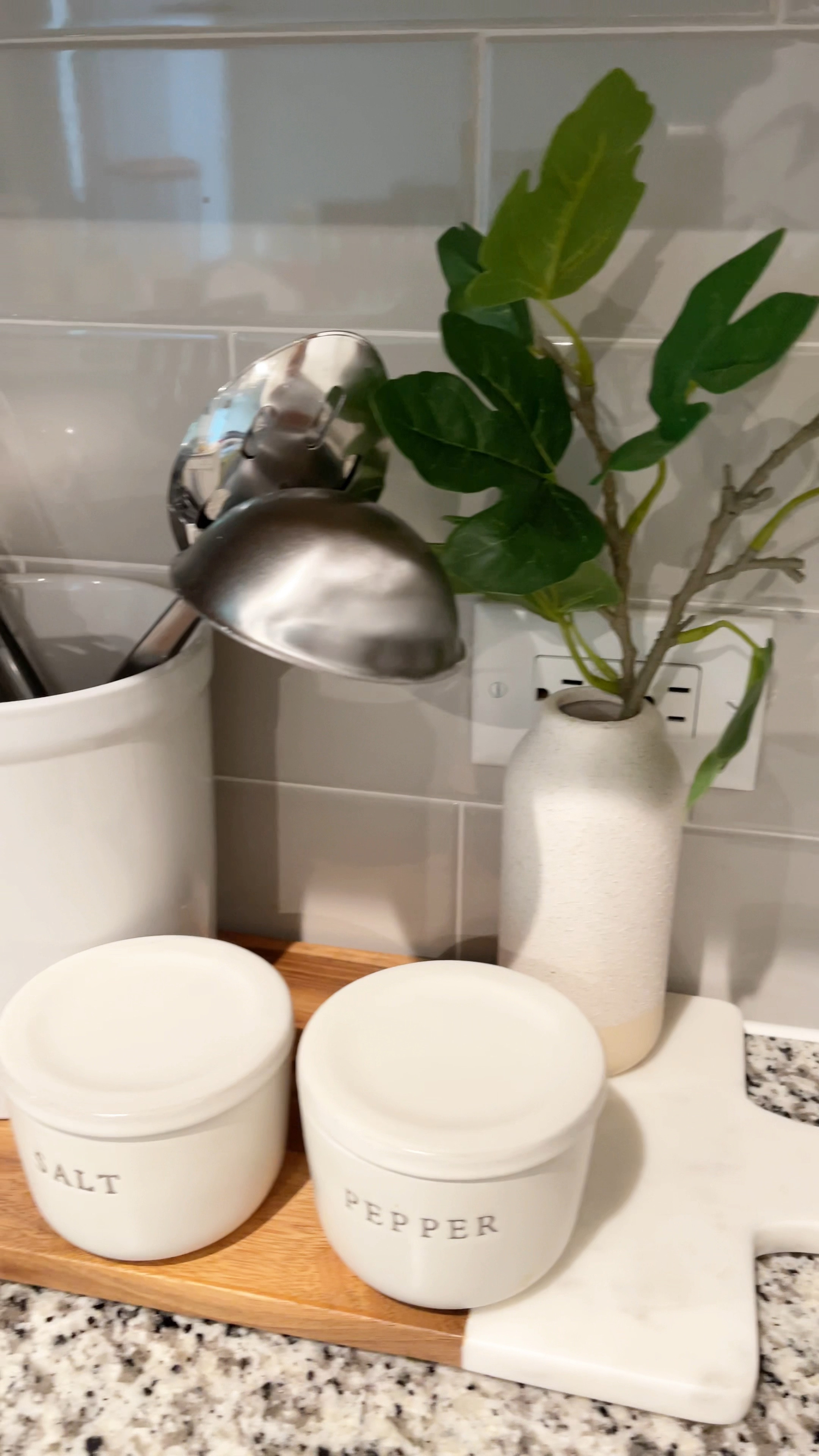 Kitchen counter styling idea with wood and marble tray, salt and pepper canisters, white utensil crock and small plant. 

#LTKunder50 #LTKhome #LTKFind