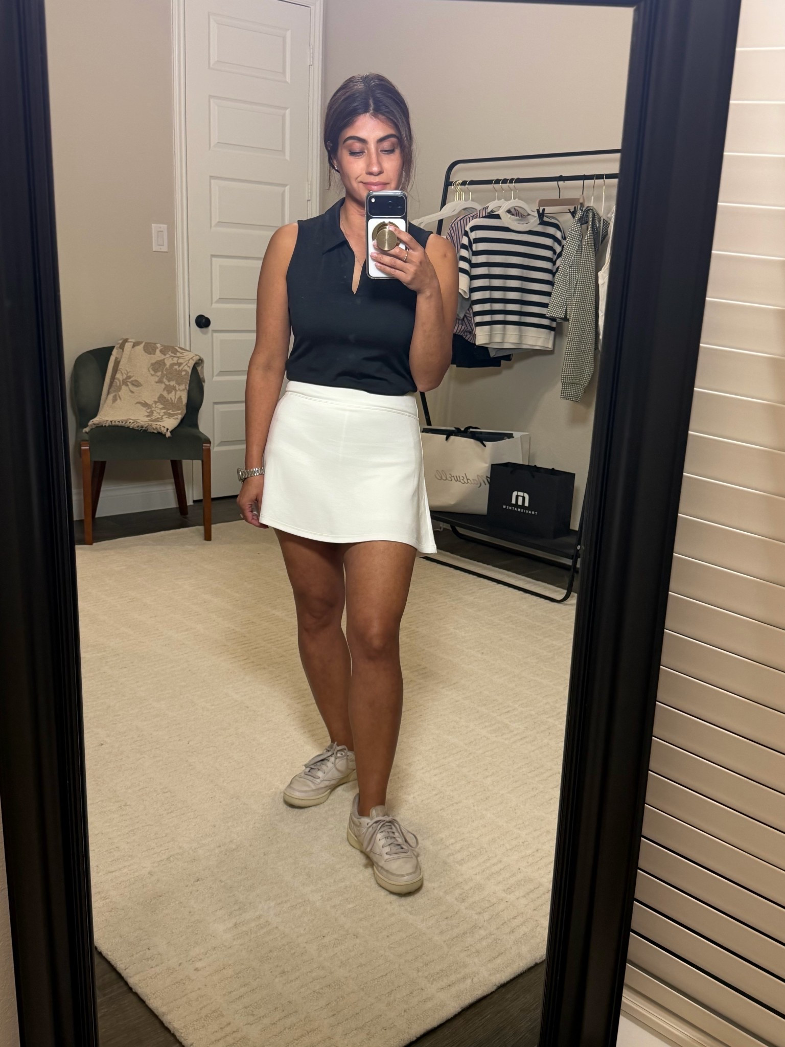 Sporty, simple, and comfortable.
Sleeveless polo + white skort + classic sneakers.

Wearing Small in top and bottomm