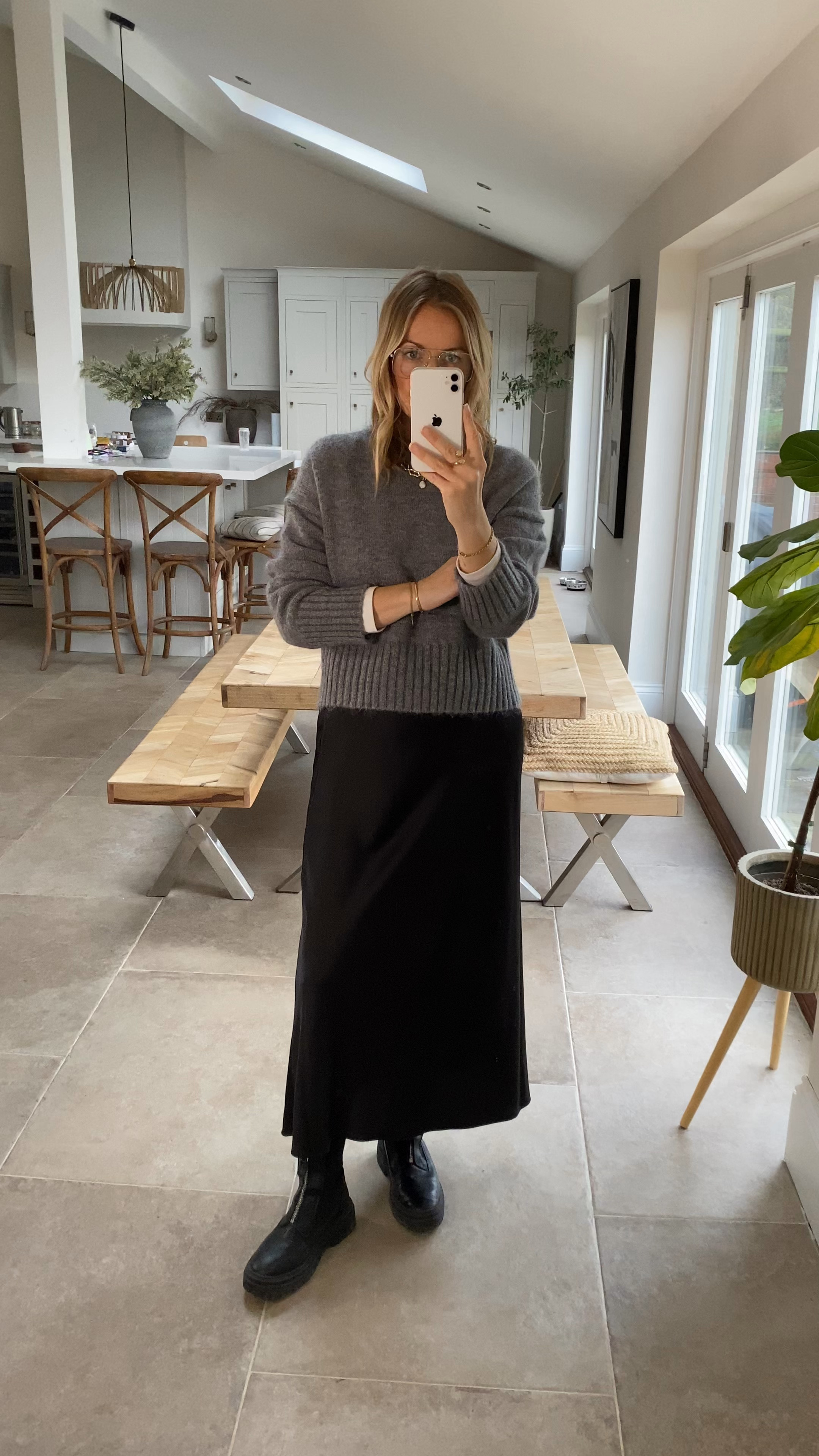 A shorter length knit is a great option if you don’t want to tuck in your top - it’s also great at disguising any tummy as it cuts through the middle section. 
Wearing a U.K. 14 in the jumper and a size large in the skirt . 

My boots are last season so I’ve linked alternatives . 

#LTKstyletip #LTKwinter #LTKuk