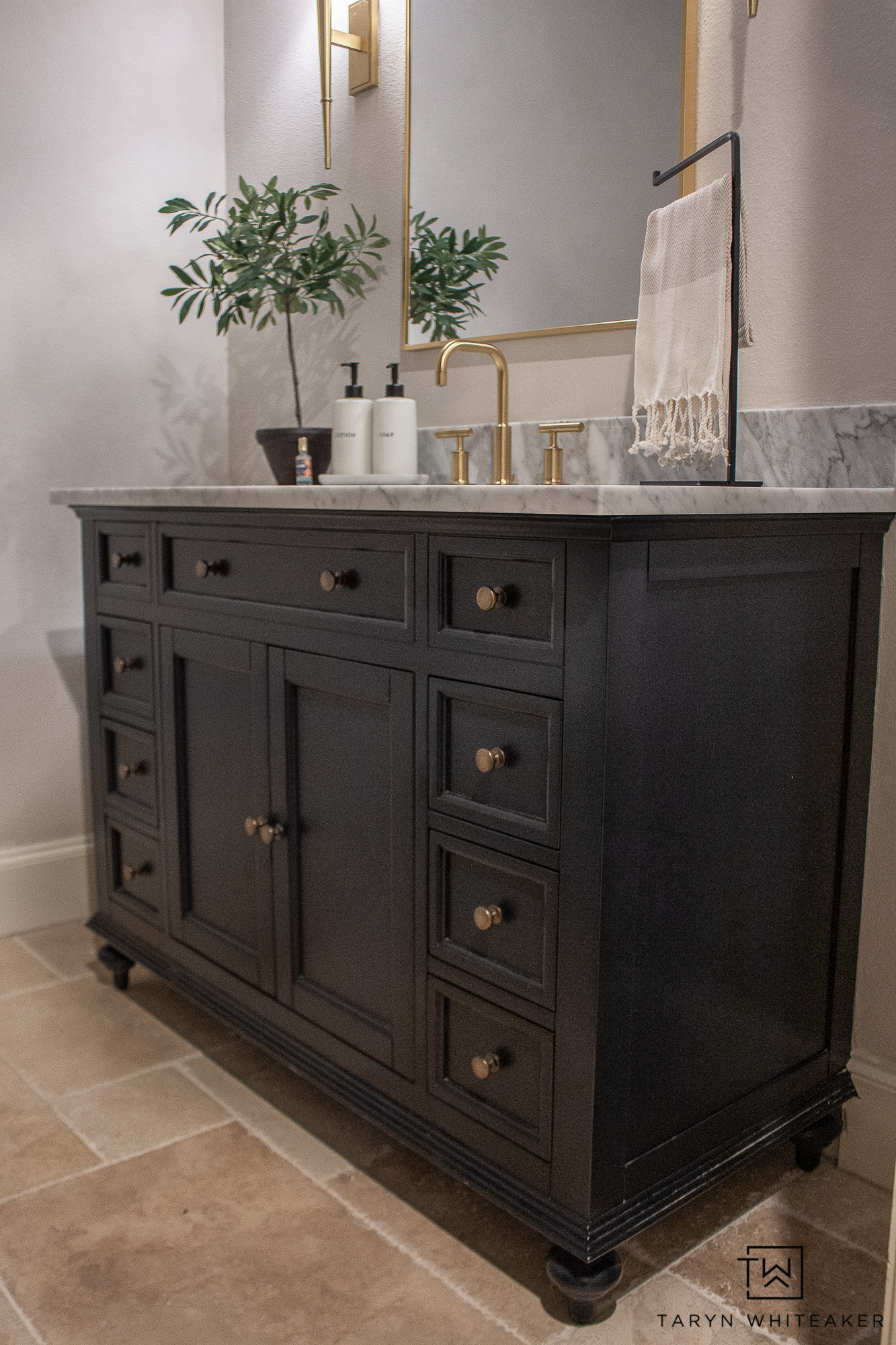 A timeless mix of contrast and texture. The deep black vanity paired with marble and brushed brass feels both classic and modern. The perfect balance of warmth and sophistication for any bathroom update.

neutral bathroom, modern traditional style, black vanity, marble countertop, gold faucet, bathroom inspiration, timeless design, home remodel, classic bathroom style, bathroom makeover

#LTKSeasonal #LTKHome #LTKStyleTip