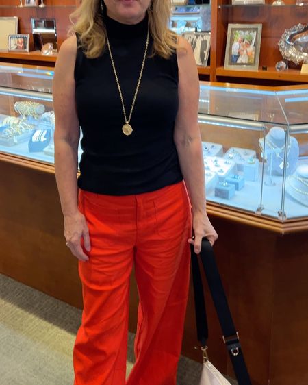 Attended the JAME WIN jewelry pop-up at a jewelry store in downtown Charleston last night. Love these tamale red linen pants with pockets in the front and felt absolutely in love with Jane wins Charleston charm on a long chain. I love it with a sleeveless mock neck  shirt. Necklaces are 14kt plated from a woman-owned biz. 

#LTKVideo #LTKOver40 #LTKStyleTip