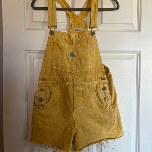 Yellow Levi’s short overalls. | Poshmark