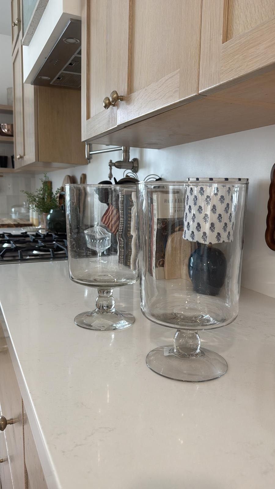 You can use this hurricane glass is so many ways. I've used it as a candle holder in the winter or holding faux leaf stems in the fall! Added bonus, it's super affordable! 

 #LTKSeasonal #LTKHome