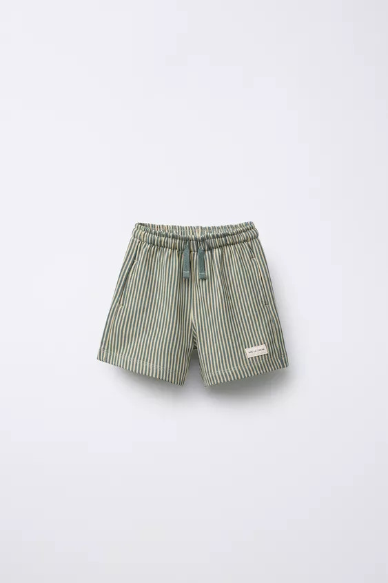 Plush shorts with elastic waistband and adjustable front drawstring. Pockets with piping detail a... | Zara US