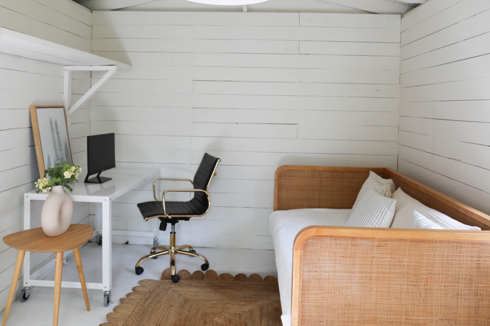 In this Airbnb property, we converted a backyard shed to an office - mainly with a coat of white paint, and some furniture: a white desk, black office chair, and a cane daybed. This makes it a flexible space for guest overflow or for zoom calls when the main house is too busy with summer hosting. Linking exact and similar pieces here. 

#LTKHome #LTKSaleAlert