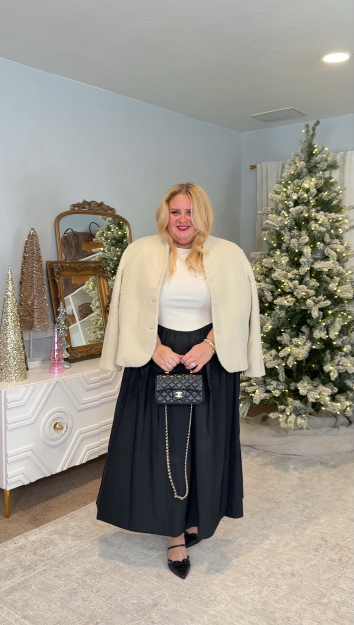 Classic, simple, and expensive looking without the price. This cream top and black skirt combo is one of the easiest holiday outfits to pull together and always looks polished. The jacket is the softest faux-fur texture and instantly elevates everything. I’m wearing a 1X in the top, 1X in the skirt, and a 2X in the jacket. Comfortable, elegant, and zero effort.

#LTKFindsUnder100 #LTKPlusSize #LTKHoliday