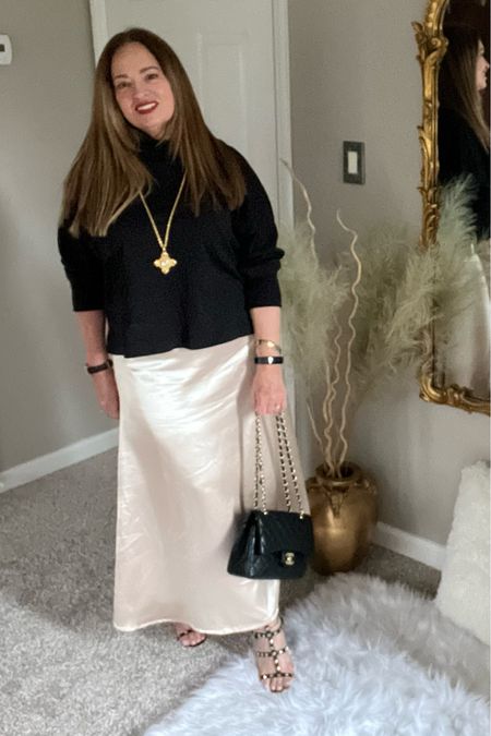 A champagne hue satin maxi/midi skirt. I love the versatility and high waist. Plus, it is perfect for year round wearability. @makemechic I kept it simple with my luxe black turtleneck and a long pendant.



#LTKstyletip #LTKfindsunder100 #LTKSeasonal