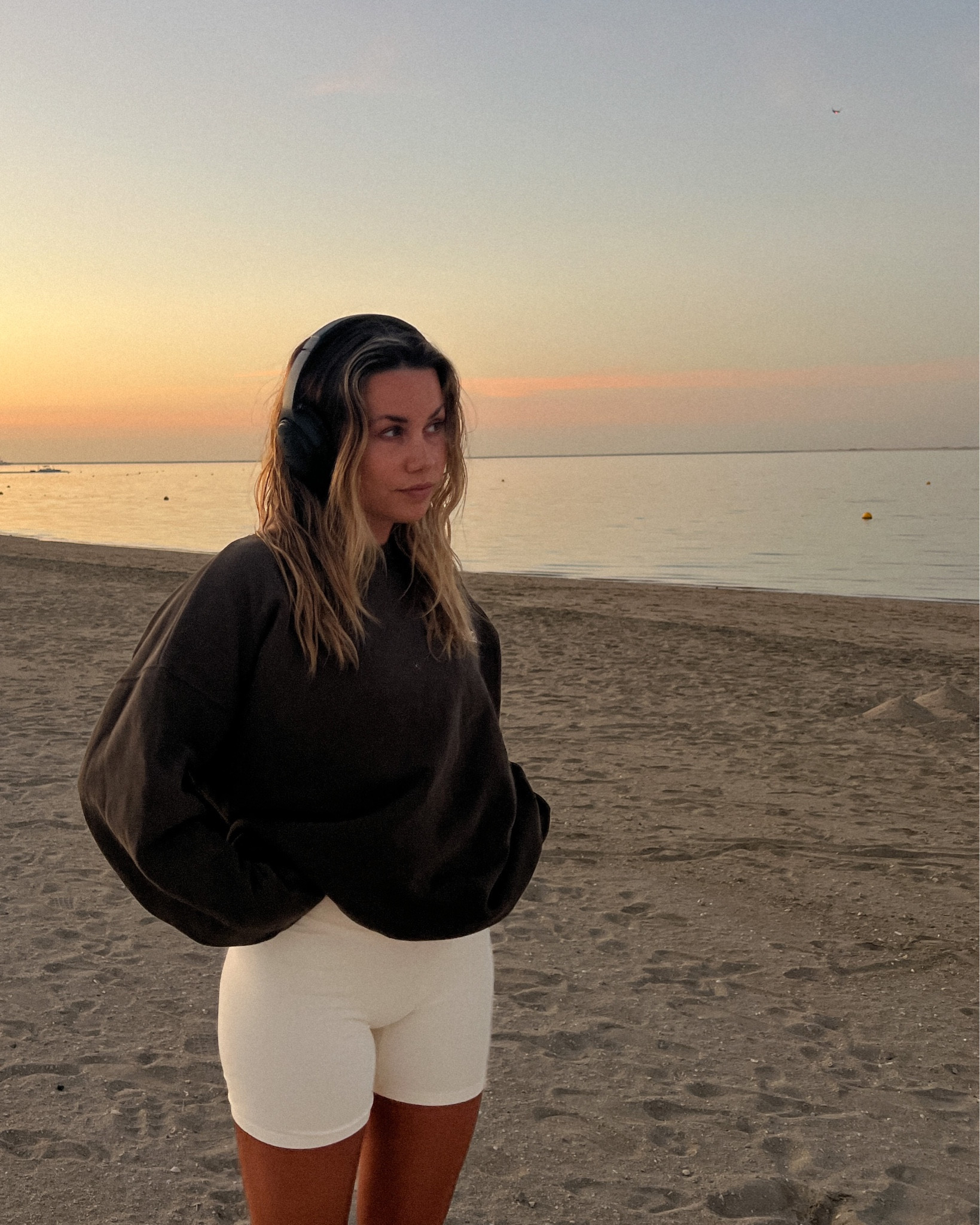 Cosy spring summer casual outfit - Bose noise cancelling headphones with adanola forest brown sweatshirt and marshmallow white shorts 

#LTKunder100 #LTKtravel #LTKSeasonal