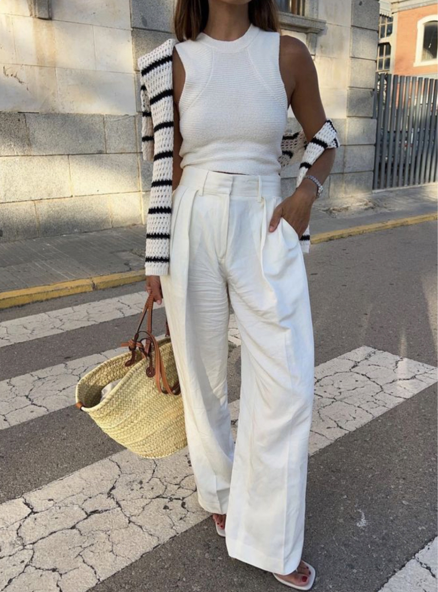 All white linen outfit with a black and white striped sweater around the shoulders and a tan and rattan tote bag. Work outfits. Travel outfits. Outfits for Italy and Europe. Workwear. Rich aesthetic. Classic style.

#LTKstyletip #LTKworkwear #LTKtravel