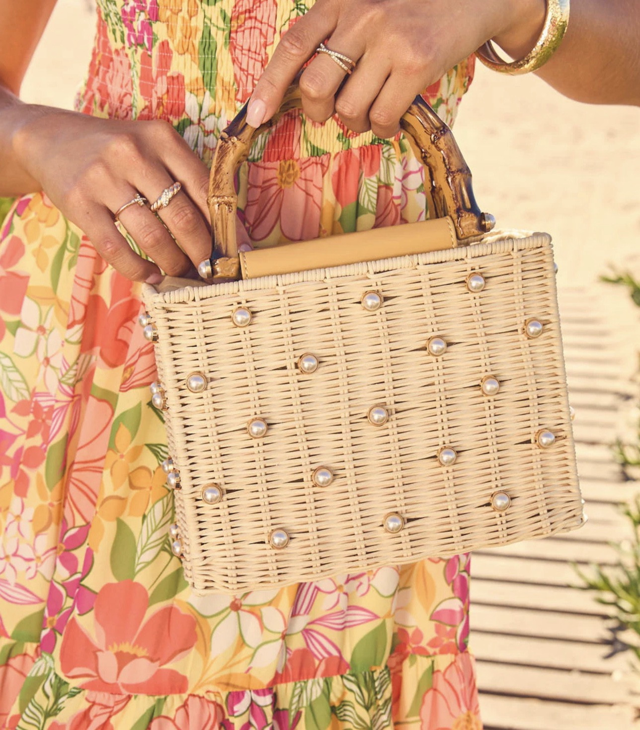 Leave your out-of-office on read and claim the best cabana! The Island Light Embellished Straw Basket Tote is your ultimate girls' trip essential. Showcasing gorgeous woven straw fabric with chic faux pearl embellishments, this hard case structure protects all your sunny necessities. Keep your gloss secure in the top drawstring pouch and carry it by the structured wooden top handles. Book the flight and look flawless!

FINAL SALE
Woven straw fabric with faux pearl embellishments
Top drawstring pouch
One main compartment
Structured wooden top handles
Hard case structure
Measurements: 8.875" L x 3.75" W x 6.75" 
@VICI 

#LTKFestival #LTKSaleAlert #LTKdayinmylife