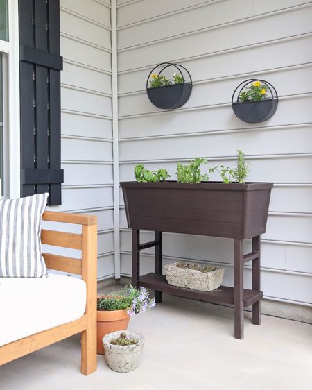 #ad Spring front porch refresh with @loweshomeimprovement with a raised garden bed, spring annuals, and fresh herbs! #lowespartner #porchdecor #outdoorplanters #gardenbed #herbgarden #springporch

#LTKhome #LTKSeasonal #LTKsalealert