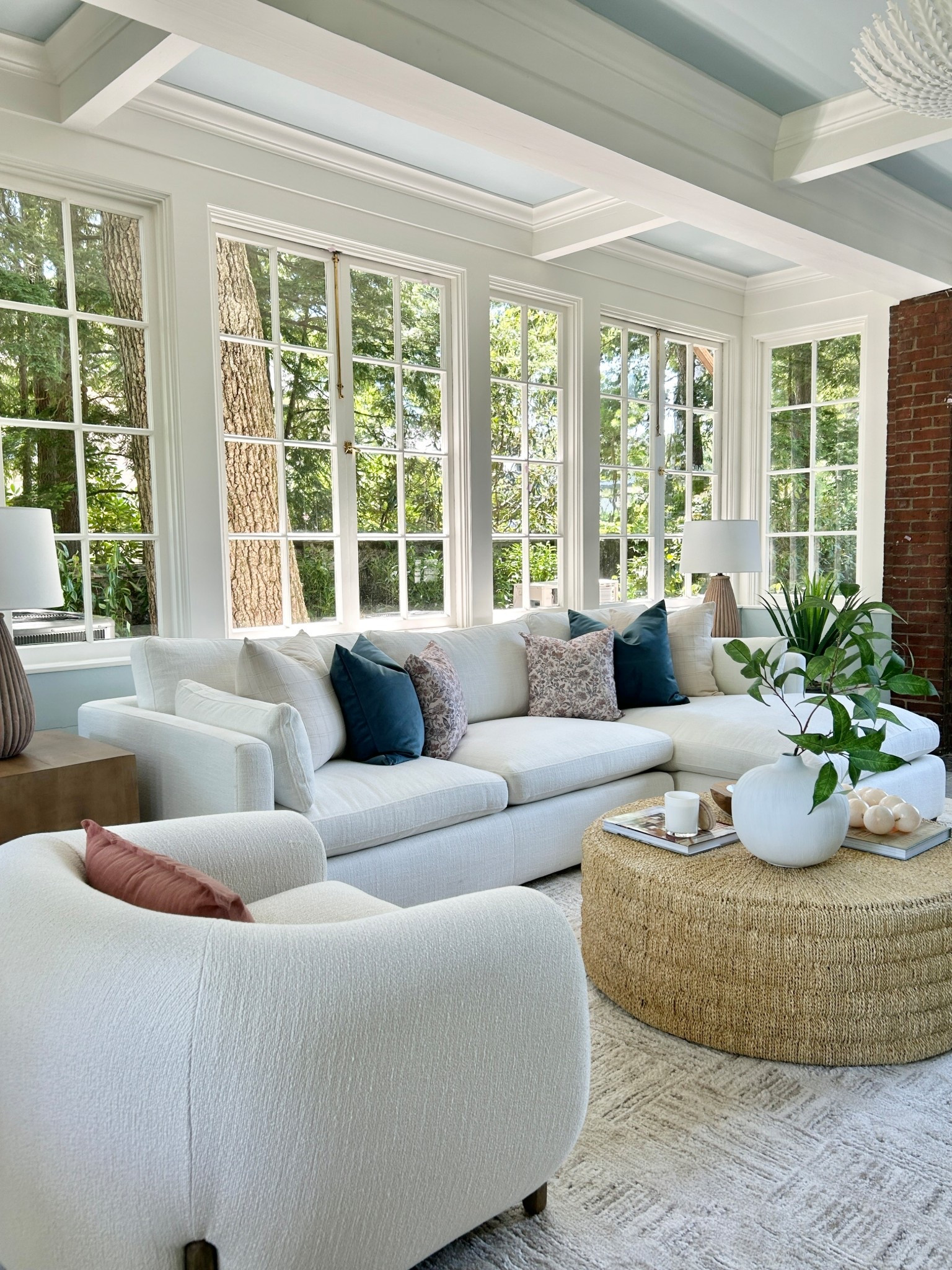 Summer inspired family room.  White sectional with woven round coffee table.

#coffeetable #sectionalsofa



#LTKHome