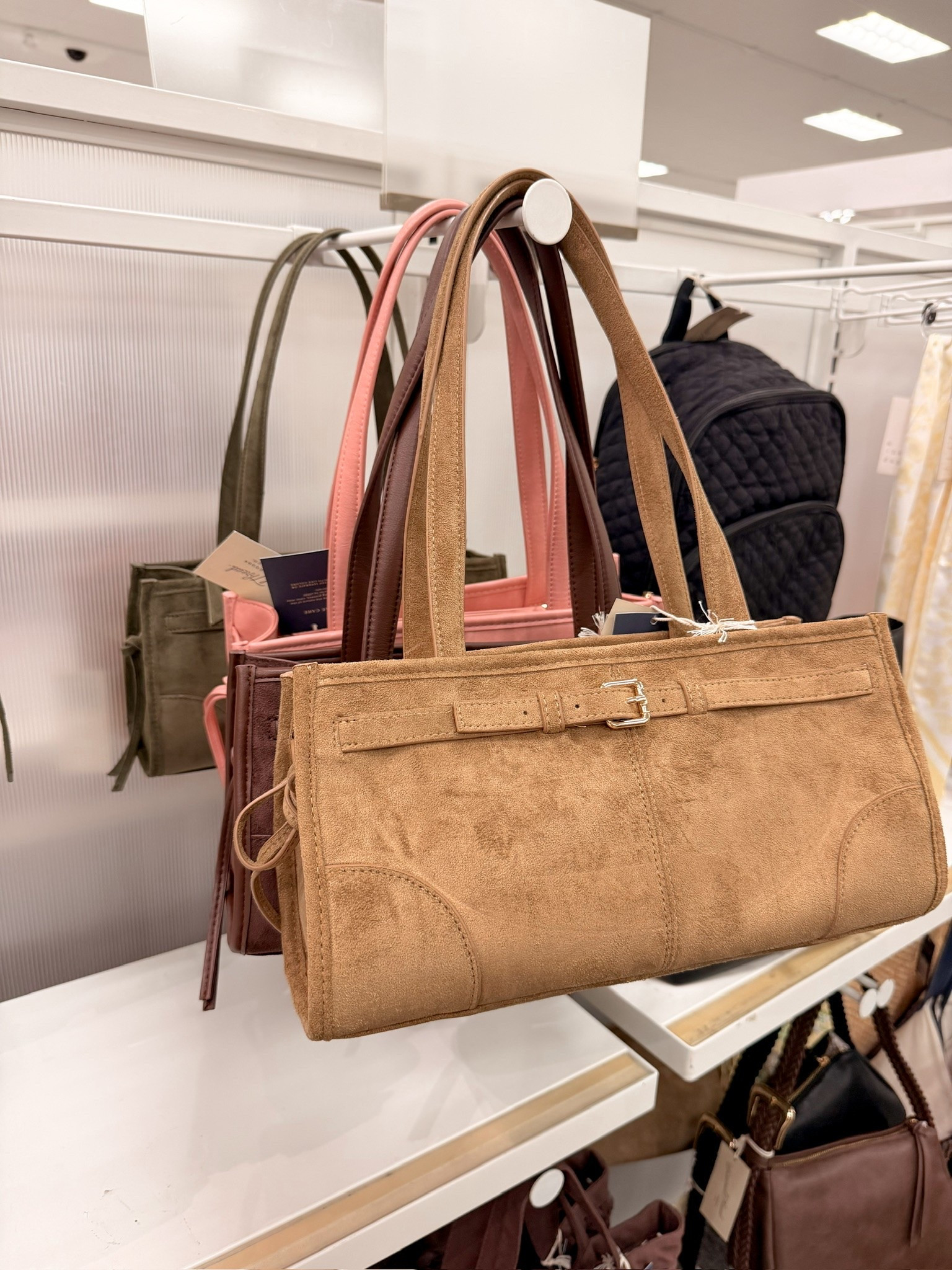 @Target This tan suede tote from Target with the buckle strap detail is such a good fall bag find 🤎 Structured but still soft, and it looks so much more expensive than it is. Linking below!

#LTKootd #LTKSeasonal