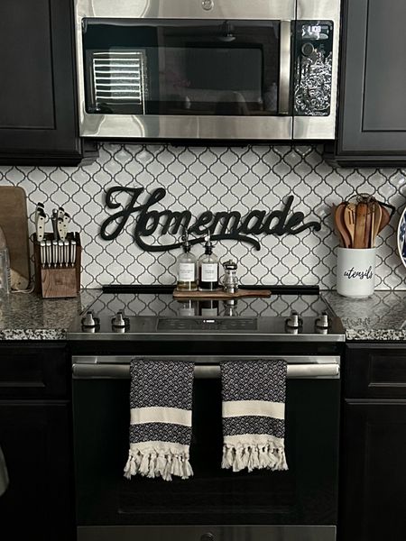 Love to keep the kitchen black and white adding small pops of color, linking my knives, kitchen towels, and other items as pictured or similar #kitchen #kitchendecor #kitchenaccents #contrastkitchen #blackcabinets #turkishkitchentowels #knifeset #utensilholder #cuttingboard 

#LTKFindsUnder50 #LTKSeasonal #LTKHome