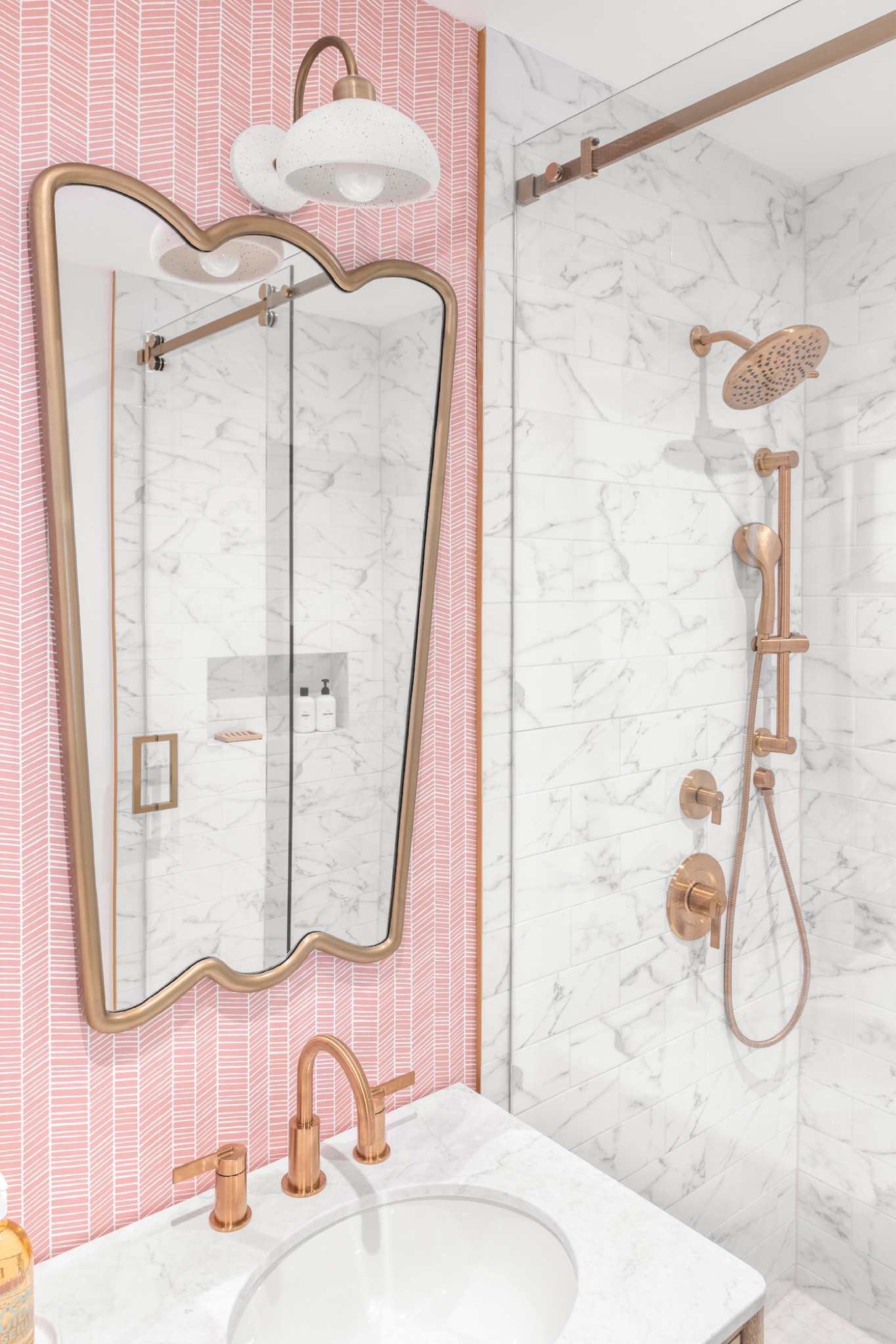 This partial gut renovation was tailored for a dynamic family of four. Each space was meticulously crafted to reflect the eclectic taste of its owners. Explore the unique features that define this home's vibrant personality.

Beyond being a place to get clean, this kid's bathroom transforms into a whimsical space with chevron-patterned wallpaper and chic mirrors carrying through the design elements in the house and allowing bath time to become an adventure, infusing a bit of whimsy into the daily routine for the kids.

#LTKhome