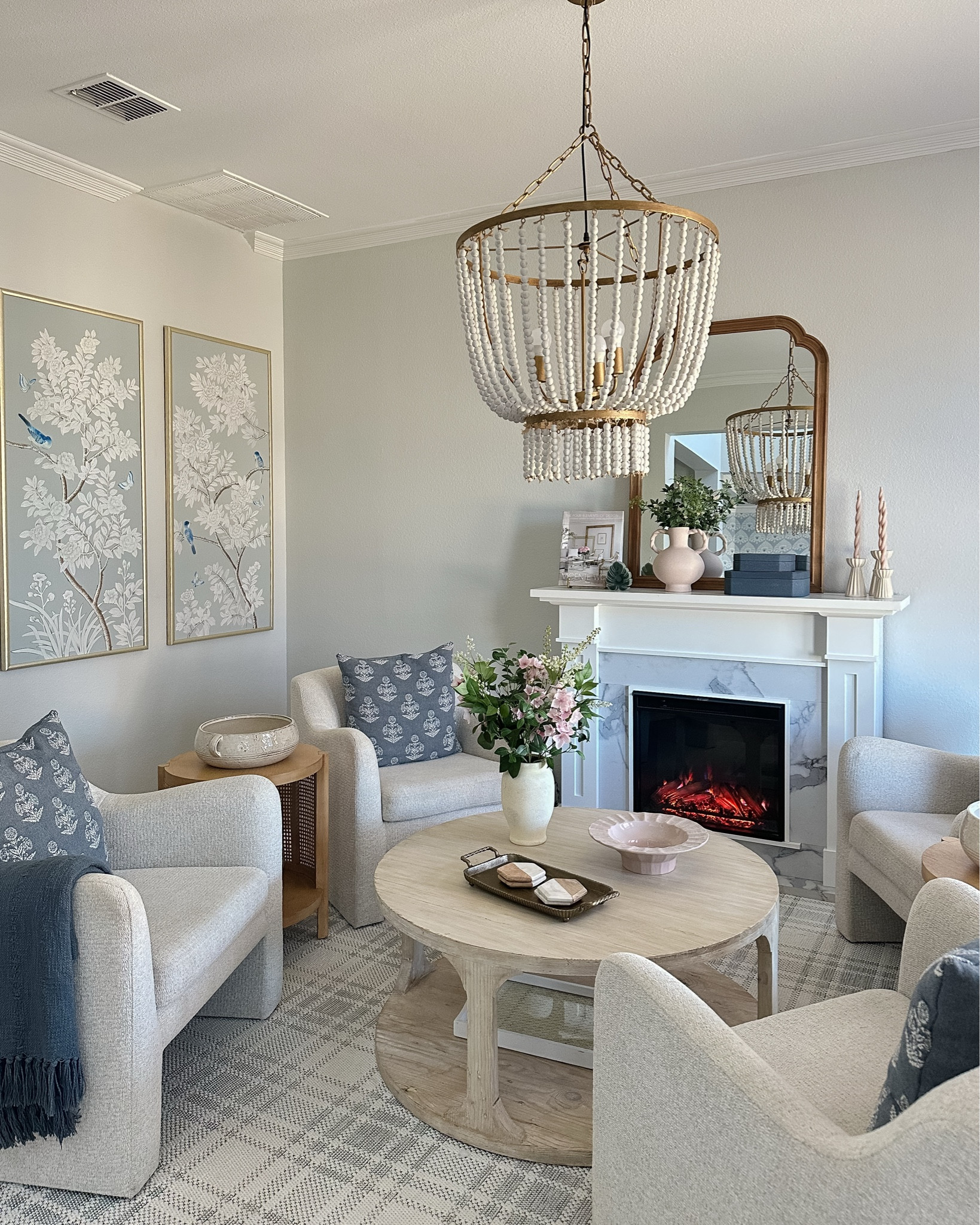 Obsessed with these Target home finds! They add the perfect mix of elegance and texture to my space. 

Twisted Brass Book Holder & Coffee Table Book

Large & Small Blue Shagreen Boxes

Statement Floral Potted Arrangement 

Twisted Handle Ceramic Vase with White Seeded Leaf Stems

Brass Footed Tray with Handles

Pink Ceramic Hand-Molded Pedestal Bowl

Set of 3 Ceramic Ribbed Taper Candle Holders with Pink Twisted Candles

Faux fireplace, coffee table, sitting room, 

#LTKHome #LTKStyleTip #LTKFindsUnder50