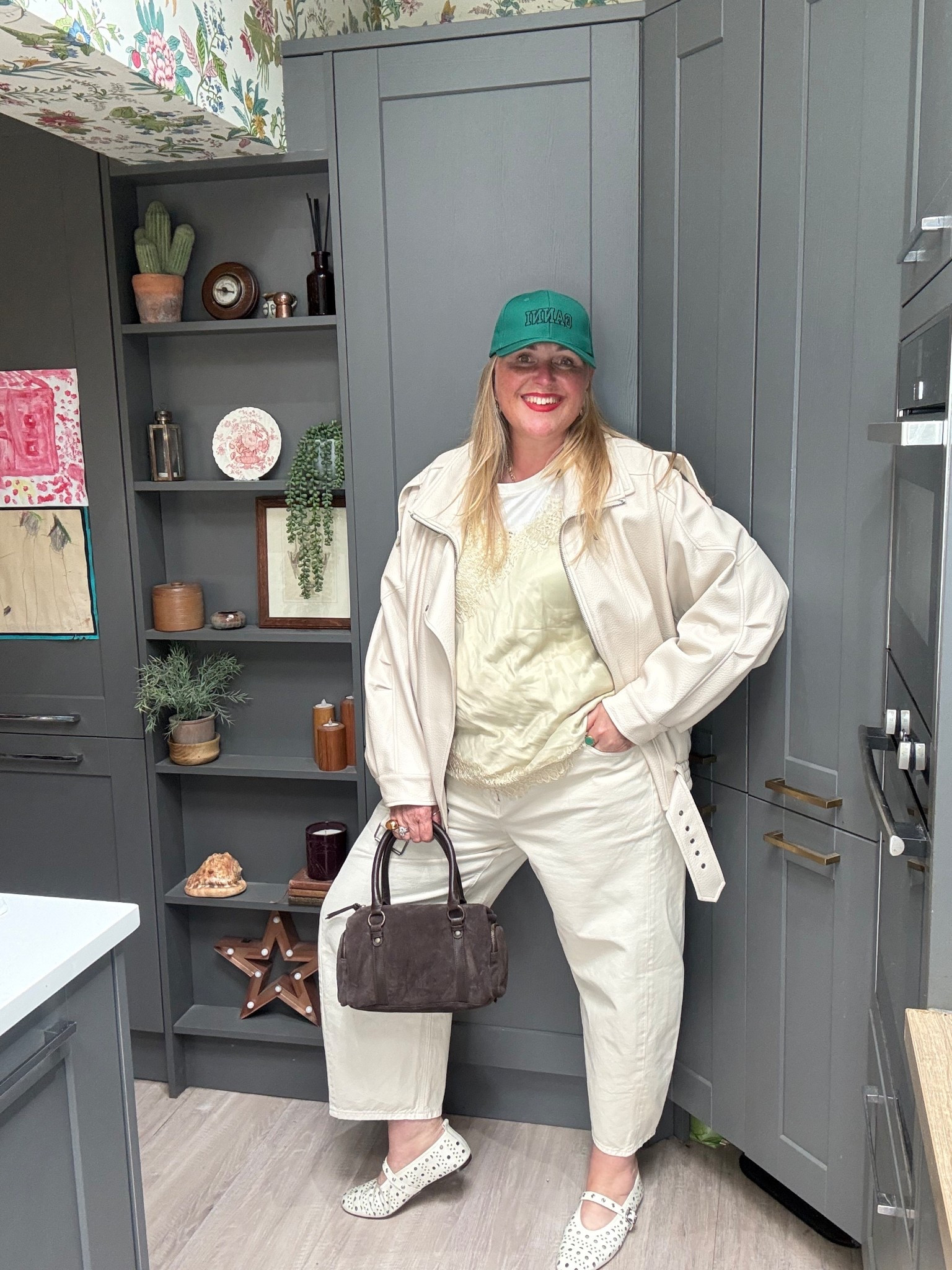 Green cap, dot tshirt, camisole, cream barrel jeans, cream ballerinas, brown suede bag, cream faux leather jacket 

#LTKspring #LTKplussize #LTKjeans