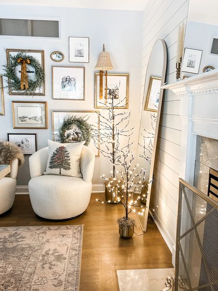 Excited to sit near the fireplace in this cozy corner!

Fireplace screen, fire screen, pre lit Birch Trees, gold planter, swivel chair, Christmas throw pillow, down feather pillow insert, gold gallery frame, gold rattan sconce, arched floor mirror, cedar wreath, faux fur accent rug.
Christmas decor, holiday decor, dining room.

#LTKHoliday #LTKSeasonal #LTKhome