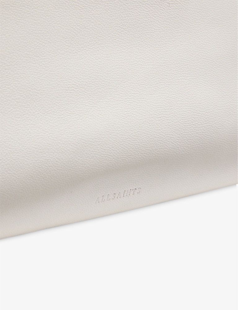 Bettina stud-embellished leather clutch bag | Selfridges