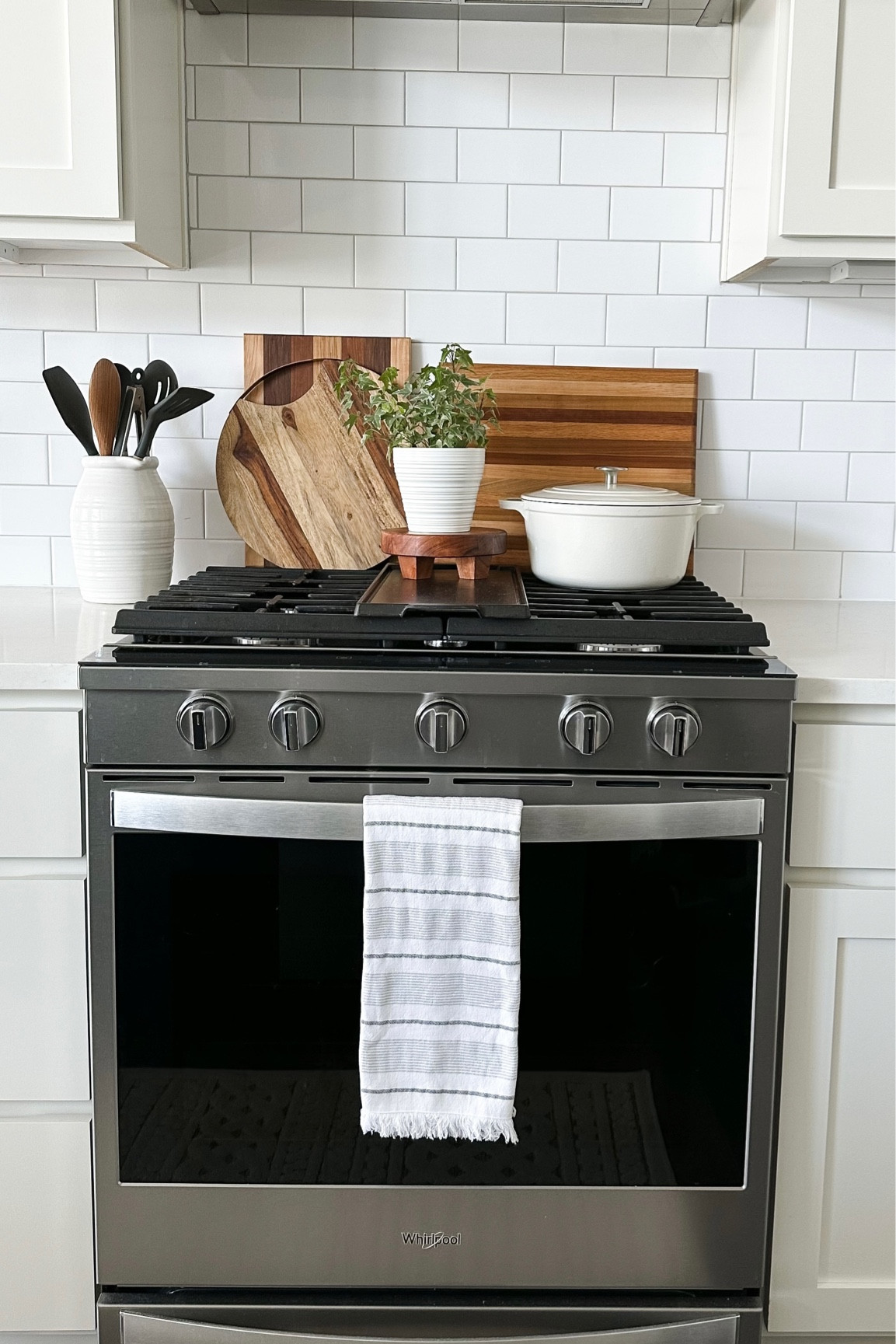 Kitchen stove styling with cutting boards, utensil holder, and Dutch oven! 

Home decor, wood stand, kitchen, kitchen styling, kitchen decor, utensil holder, white pitcher

#LTKstyletip #LTKFind #LTKhome
