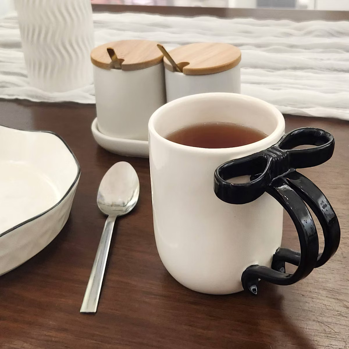 National Brand One Design Home 16 oz White Mug with Black Figural Bow Handle | Target