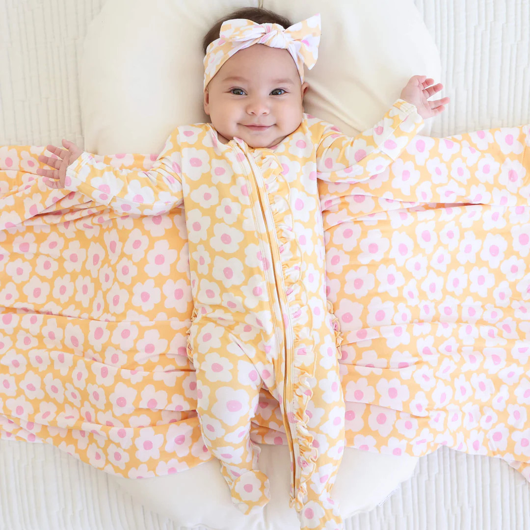 Sunshine Daisy Ruffle Zipper Footie | Caden Lane