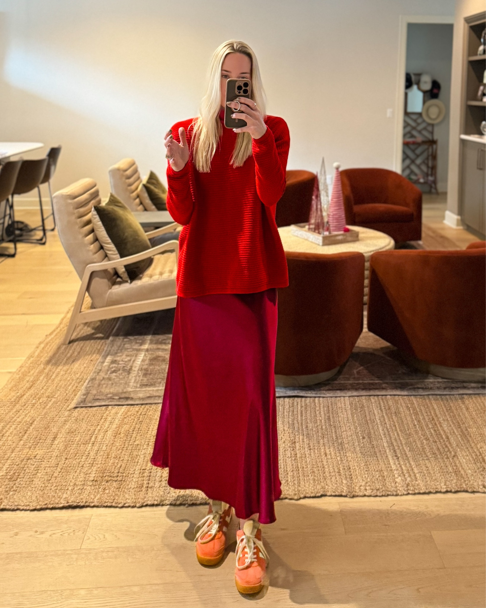 Mixing holiday textures with laid-back style. This red satin skirt and oversized sweater combo gets a colorful upgrade with Gola sneakers. ♥️❤️
•
5’6 128 lbs. wearing a size S skirt, S sweater
•
Holiday Casual Looks | Satin Skirt Outfit | Christmas Outfits | Effortless Holiday Style | Cozy Meets Chic | Monochromatic Outfit Ideas | Sneakers Outfit | Festive Looks 

#LTKHoliday #LTKStyleTip #LTKSeasonal