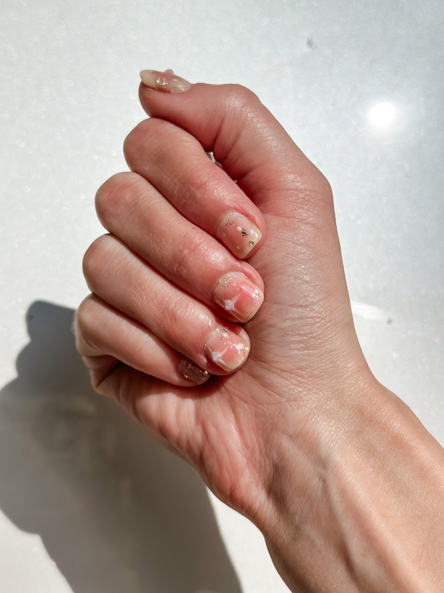 First attempt at practicing the star nail art for my honeymoon and I’m so surprised at how well they turned out. No where near perfect but better than what I expected for sure 

Base: Beetles B074 (two coats) 
Pink: Sinful Colors “Soul Mate” (applied with a sponge)
Gold glitter: Beetles A11 (part of a set)
White nail art: Beetles B684 (park of a set) applied with dot tool & skinny brush

Everything is linked below (exact pearls and glue included) 

Nails | at home nails | diy nails | nail art | at home gel | gel manicure | gelx | gel x | star nails | pearls | at home mani 

#LTKSeasonal #LTKbeauty #LTKunder50