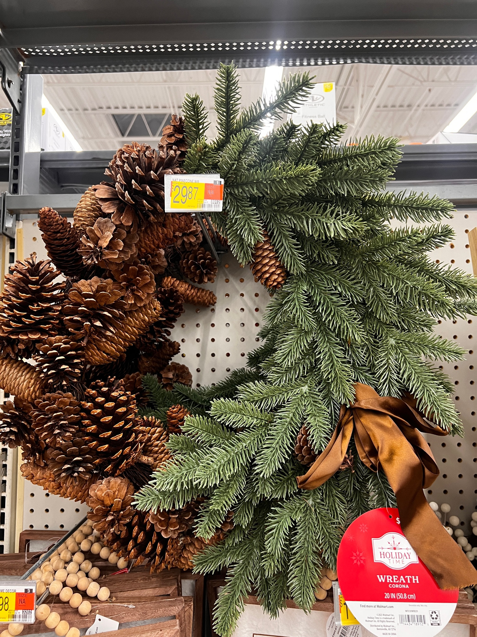 Blown away by this pinecone wreath with gorgeous brown velvet ribbon available at @walmart