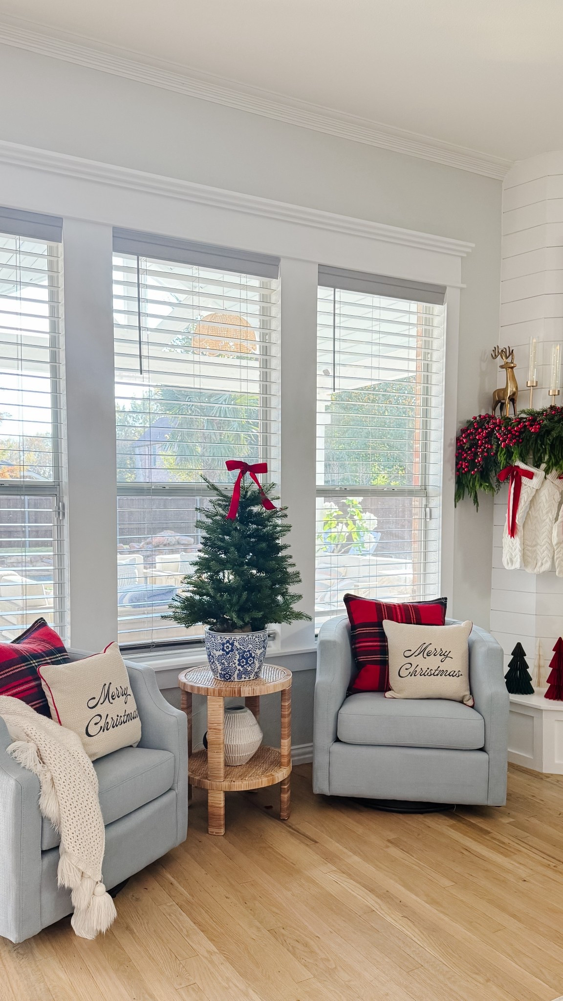 No room for a big Christmas tree? Try a tabletop one instead. 

3 foot Christmas tree
Blue and white pot
Blue swivel chairs
Tartan pillows
Christmas pillows
Knit stockings
Red ribbon bows
Gold reindeer
Ribbed glass candlesticks 

#LTKHoliday #LTKSeasonal #LTKHome