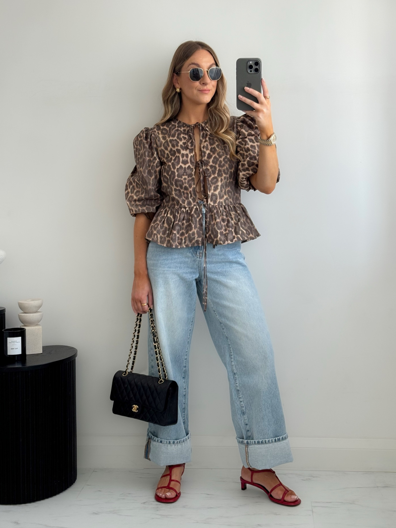 Dressing up jeans with a Leopard print blouse & red sandals 

#LTKstyletip #LTKsummer #LTKsale