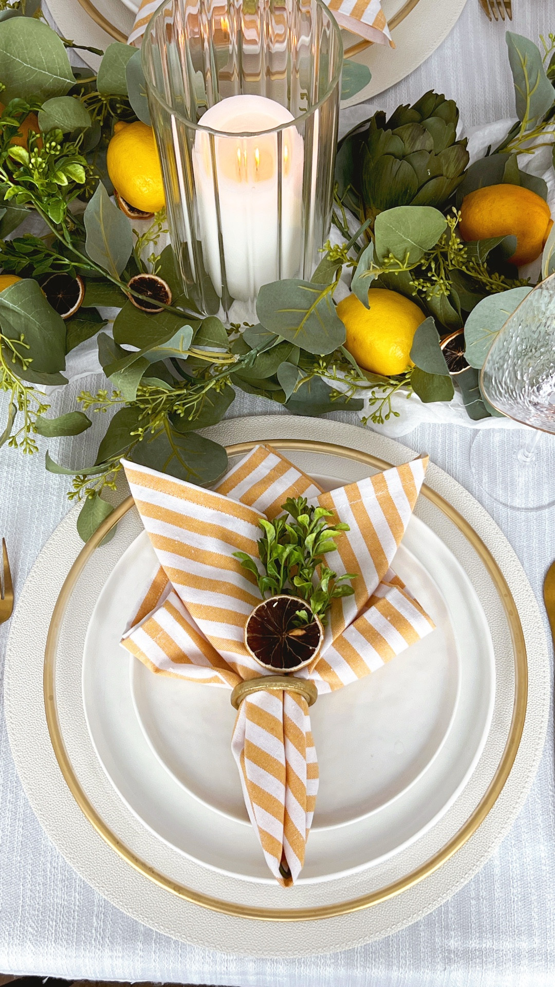 Spring tablescape, spring table decor, lemon table decor, citrus tablescape, yellow table decor, yellow, striped napkins, hammered, triangular glasses

#LTKHome #LTKSpringSale