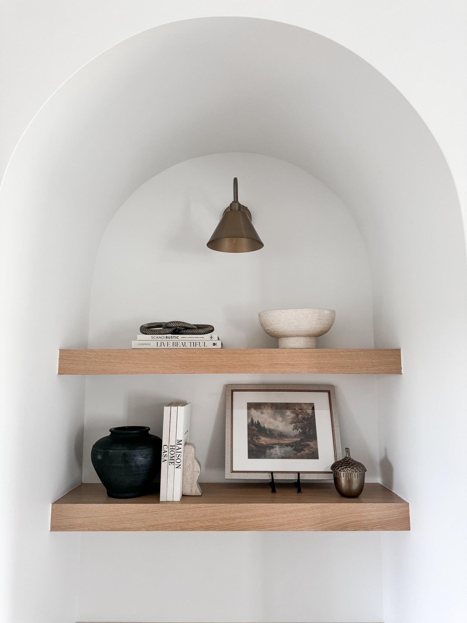 Shelf decor | shelf inspo | fall decor ~ acorn | bowl | coffee table books | modern organic | arches | sconce light

#LTKSeasonal #LTKHome #LTKFallSale