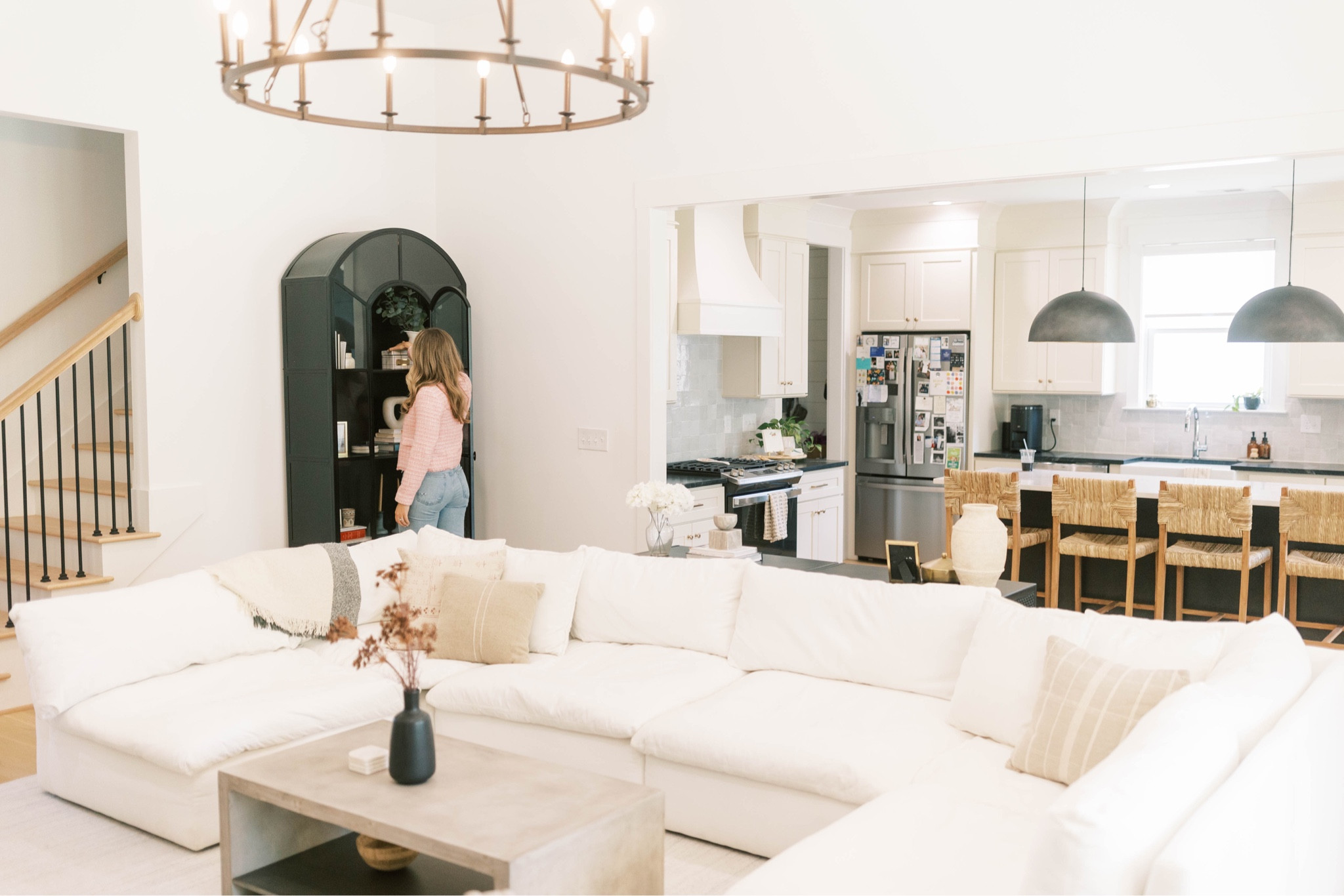 Home decor; sectional couch; pendant lights; concrete coffee table; woven barstools

#LTKhome