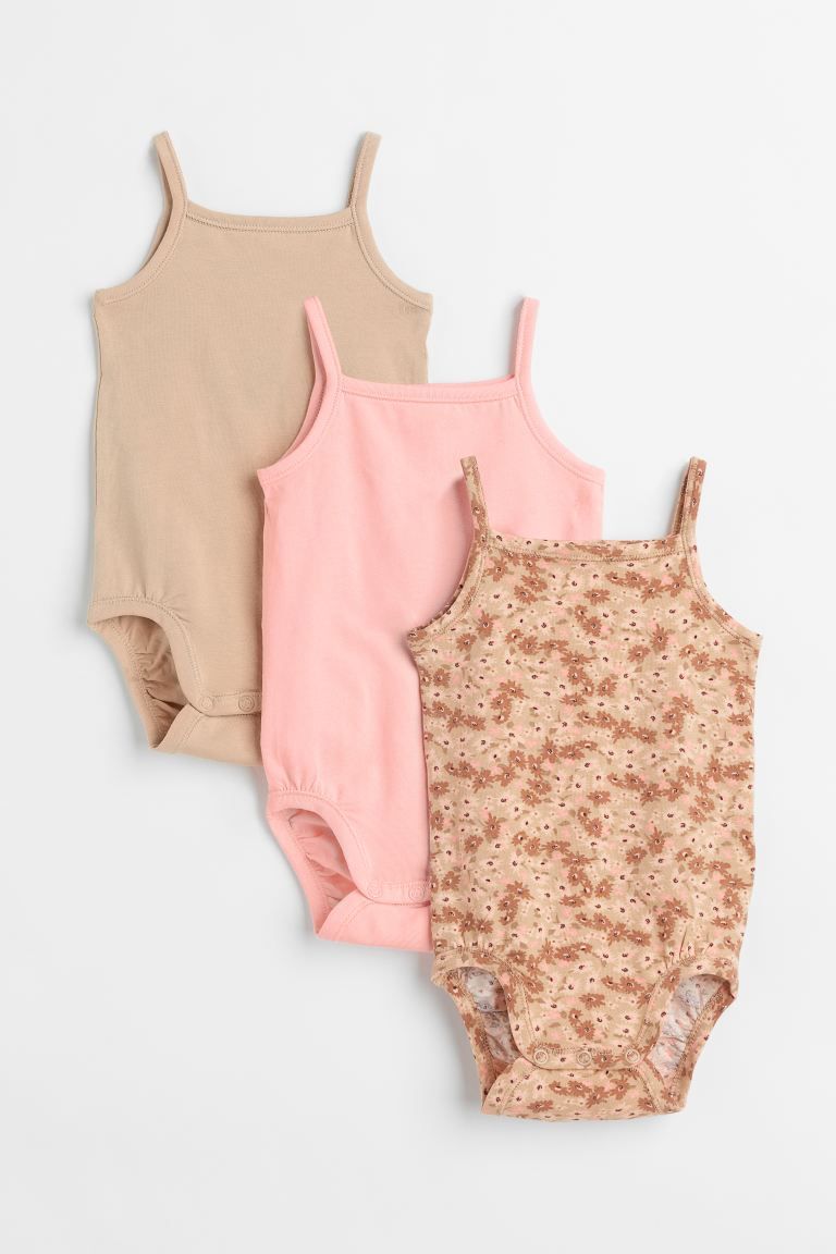 Baby Exclusive. Sleeveless bodysuits in soft, organic cotton jersey with narrow shoulder straps. ... | H&M (US + CA)