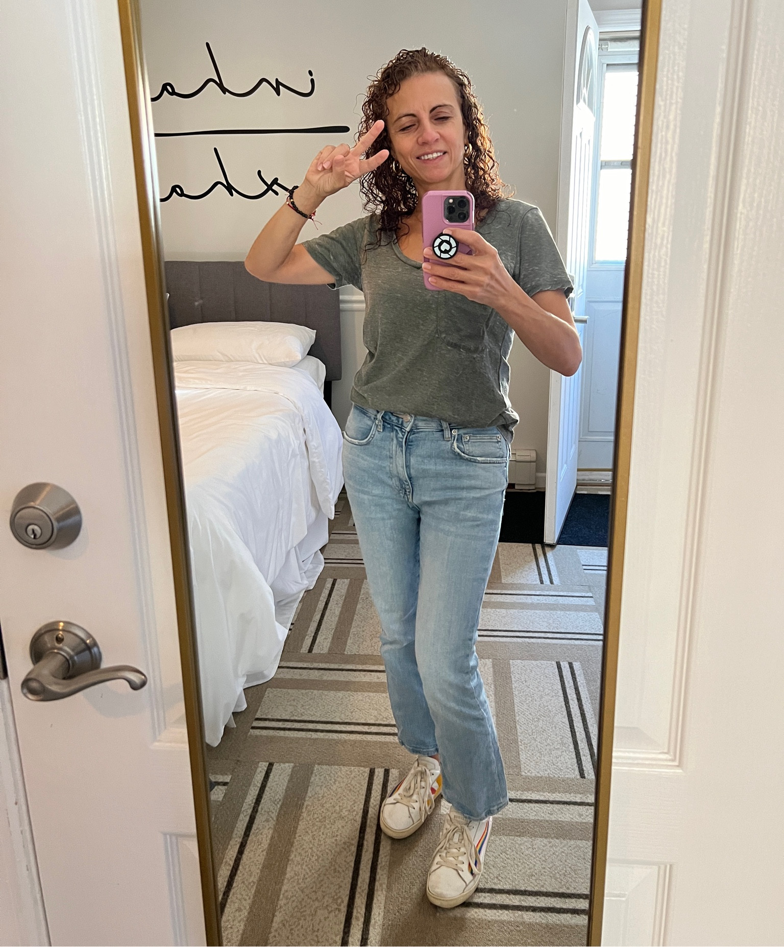 Fall fashion look for today. Olive t shirt with light wash jeans and solids good vibes rainbow sneakers. Paired with gold jewelry. Timeless fashion.  Gold mirror is perfect for checking yourself.

#LTKStyleTip #LTKTravel #LTKOver40