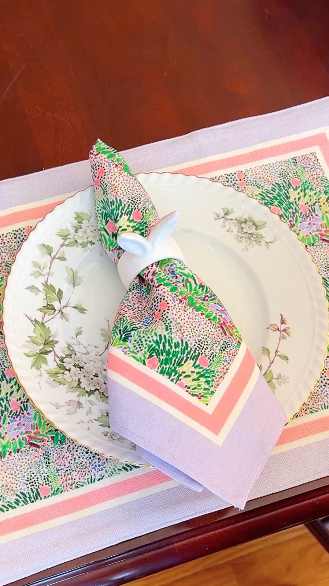 My preferred napkin fold. Love a nailing ring and neatly folded, but wide napkin. Gotta see more of that pretty pattern! Bunny rings are a find form target dollar spot!

#LTKHome