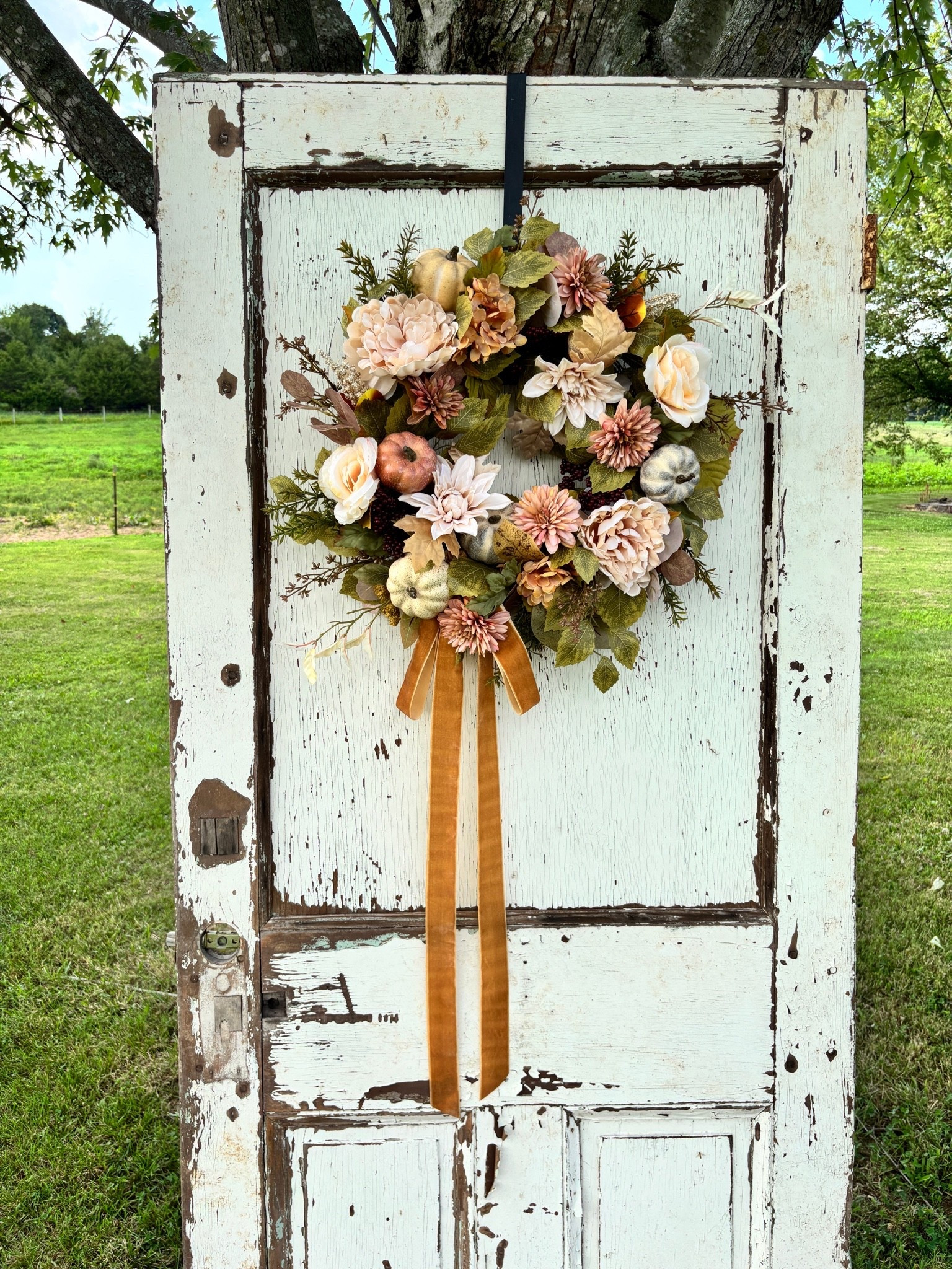 Featuring soft hydrangeas, peonies, seasonal pumpkins, and a luxurious velvet ribbon, this wreath is perfect for welcoming fall with timeless farmhouse charm.

🍁 Handmade on a 14” grapevine
🎃 One of a kind
🛍️ Available now in our Etsy shop!

#LTKU #LTKHome #LTKSeasonal