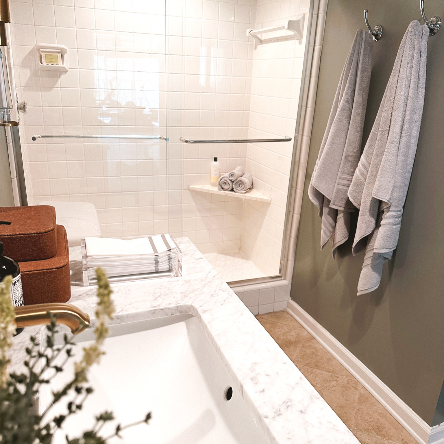 Affordable bathroom makeover with the @homedepot complete with wooden fluted vanity with a cararra marble top, a brass modern faucet, plush and soft bath towels, an arch mirror and gorgeous brass sconces- upgrade your home today with amazing Summer savings from The Home Depot 🤍 #bath #bathroom #thehomedepot #thehomedepotpartner #partner

#LTKStyleTip #LTKSaleAlert #LTKHome