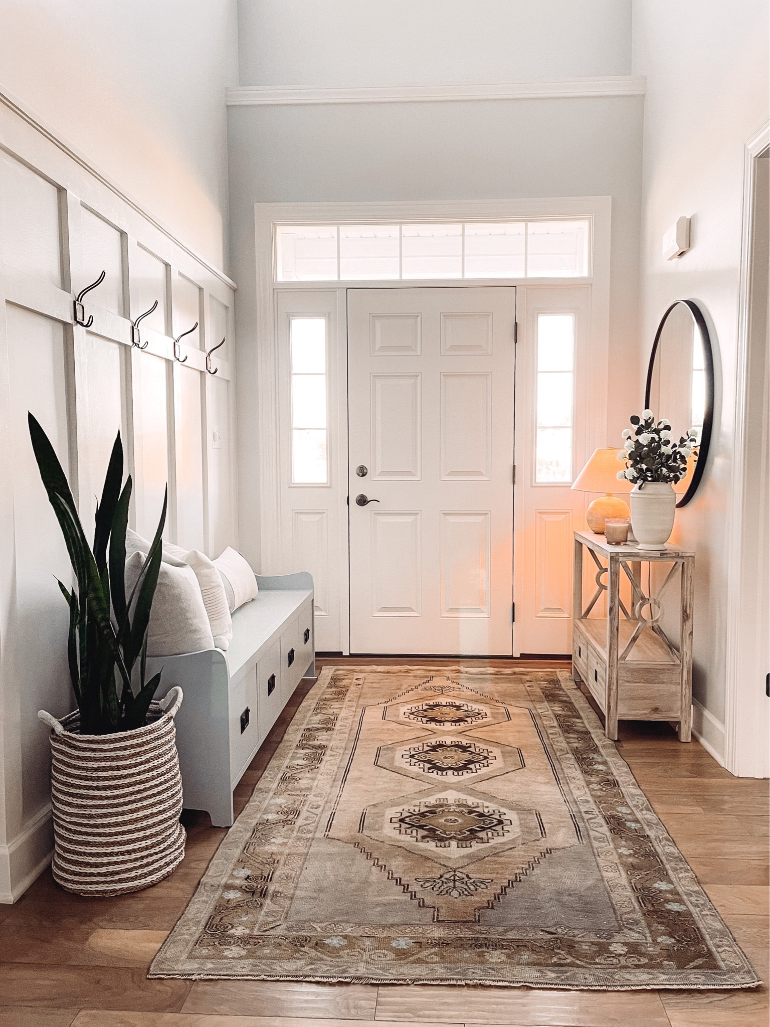 Entryway decor 

Turkish vintage rug, formal entryway, board and batten, storage bench, Pottery Barn Wade bench, BM Boothbay Gray paint, target find, console table styling 

#LTKFind #LTKhome #LTKstyletip