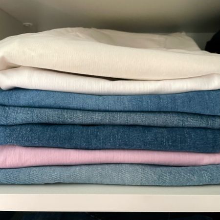 Stack of cropped demi boot cut denim 👖 of all hues 💜🩵🤍💙